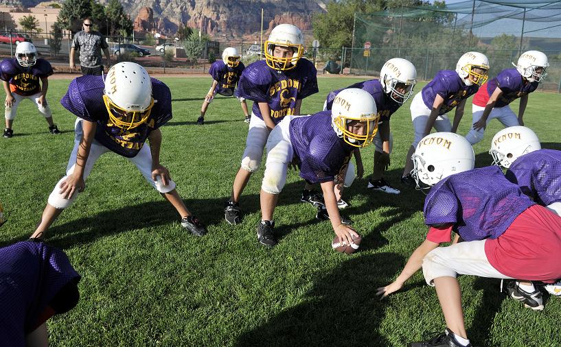 Quarterback Hayden Bruce gets set under center as his Sedona Minors football team lines up for a play in practice Wednesday, Sept. 7. The Venom won its first game Saturday, Sept. 3, defeating the Camp Verde Cowboys, 12-6.