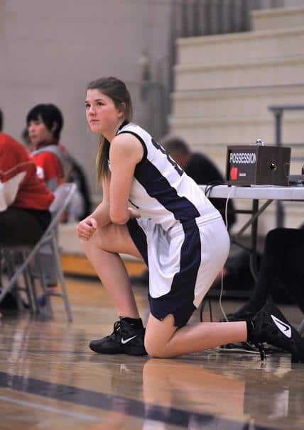 Freshman McKenna Woodford sits at the scorers’ table ready to check into the game Wednesday, Jan. 11, against Orme High School.