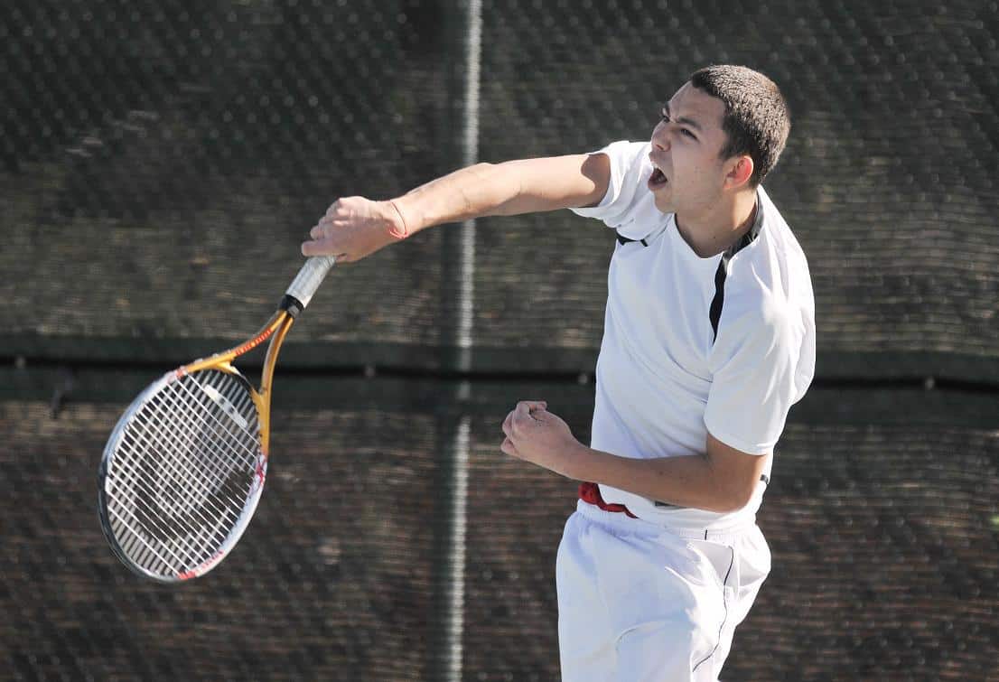 Cody Chartier, the team’s No. 1 player, serves during the Sedona Red Rock High School boys tennis team’s match at home against Prescott High School on March 9.