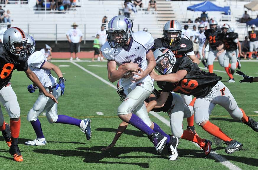 Juniors Scorpion Chas Rescigno tries to gain yardage Saturday, Sept. 8, during a youth football game against the Phoenix Fury at Sedona Red Rock High School (above). The Scorpions lost 42-0 and play their next home game Saturday, Sept. 15, at 3 p.m.